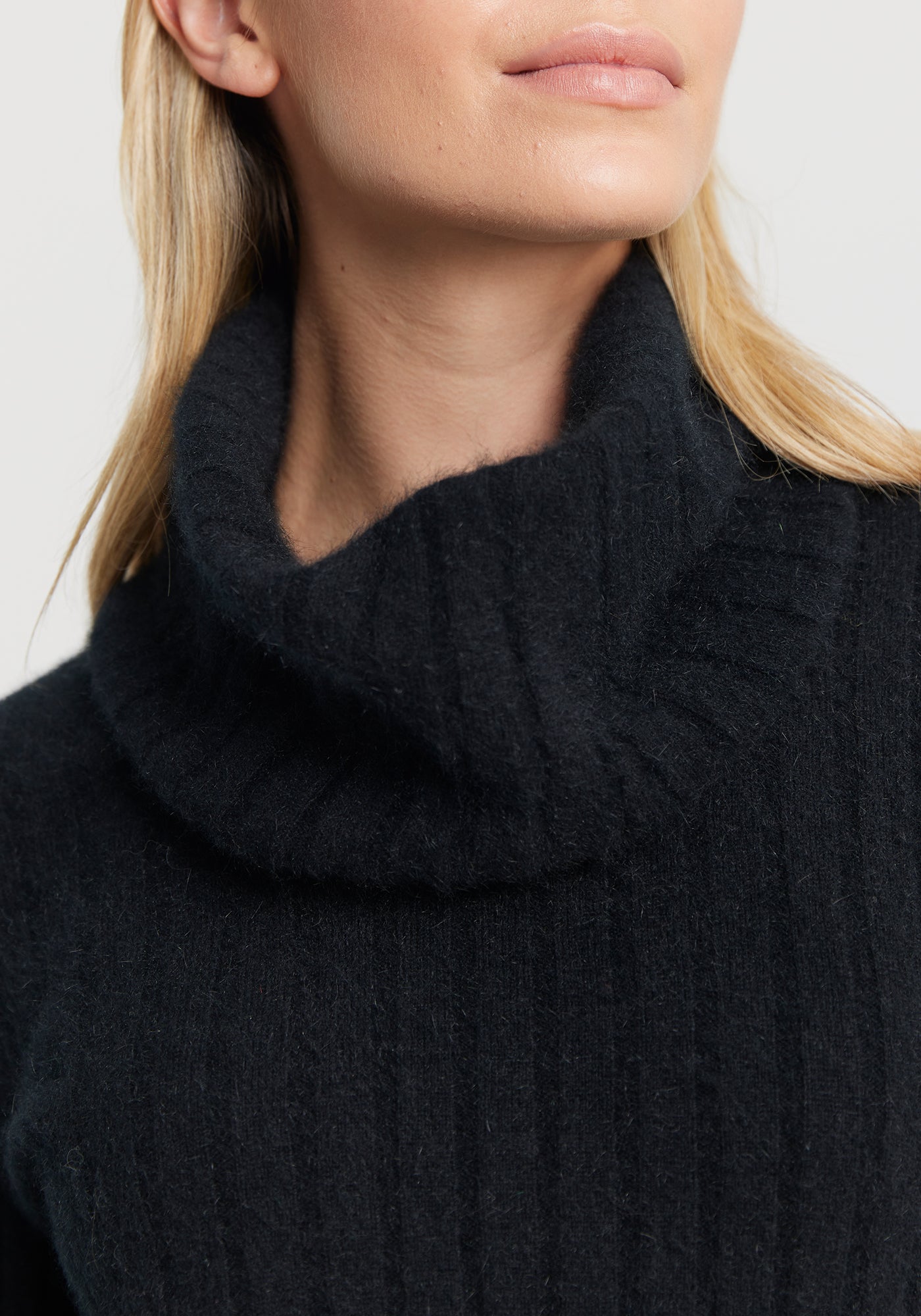 The Kapua Rib Snood from Untouched World available shopology Chrstchurch, CBD. This classic rib snood is a perfect accompaniment to anyone of your favourite kapua sweaters. Designed to wear with UTW's Kapua Rib Crew, it instantly transforms a crew neckline into a rollneck. Just what you need on icy winter days when you want to keep the cold at bay. Made from our exclusive Kapua blend of 40% Premium Possum Fibre, 40% Cashmere and 20% Mulberry Silk