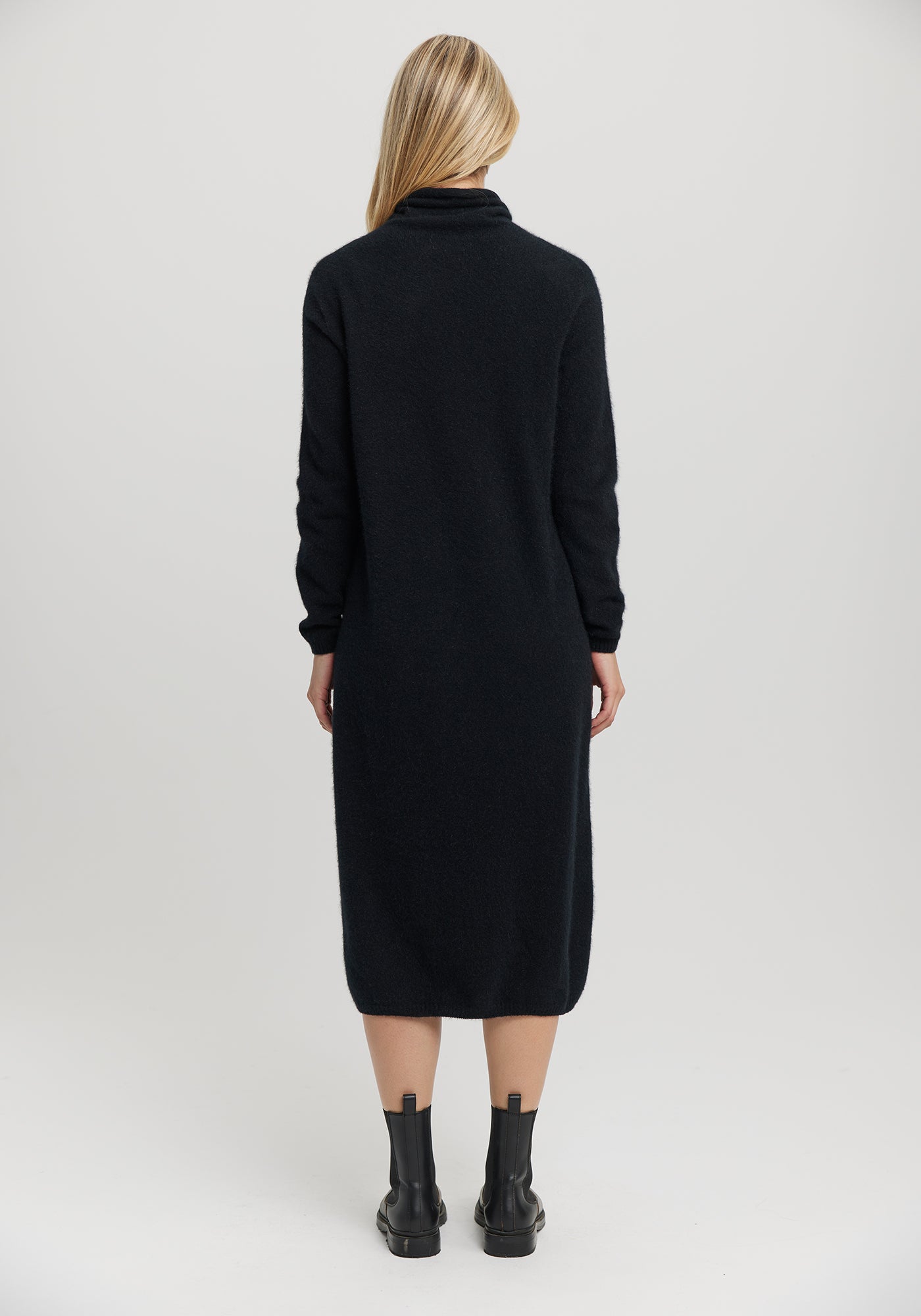 Kapua Sweater Dress from Untouched World, available shopology Christchurch CBD. With cocooning warmth, the Kapua™ Sweater Dress offers luxury like no other. Made from Untouched World's exclusive Kapua™ blend of 40% Premium Possum Fibre, 40% Cashmere and 20% Mulberry Silk Easy fit Soft mock neck Mid-length Microplastic-free Made in New Zealand Available in S - L