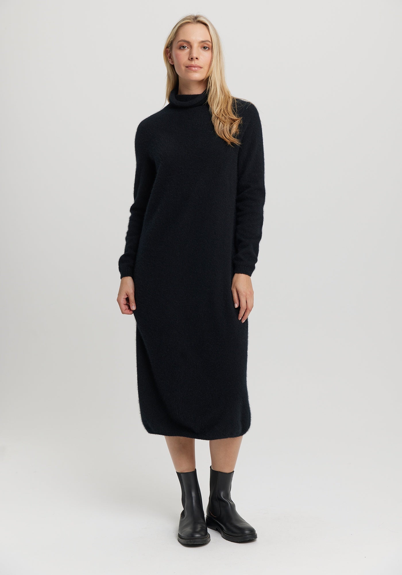 Kapua Sweater Dress from Untouched World, available shopology Christchurch CBD. With cocooning warmth, the Kapua™ Sweater Dress offers luxury like no other. Made from Untouched World's exclusive Kapua™ blend of 40% Premium Possum Fibre, 40% Cashmere and 20% Mulberry Silk Easy fit Soft mock neck Mid-length Microplastic-free Made in New Zealand Available in S - L