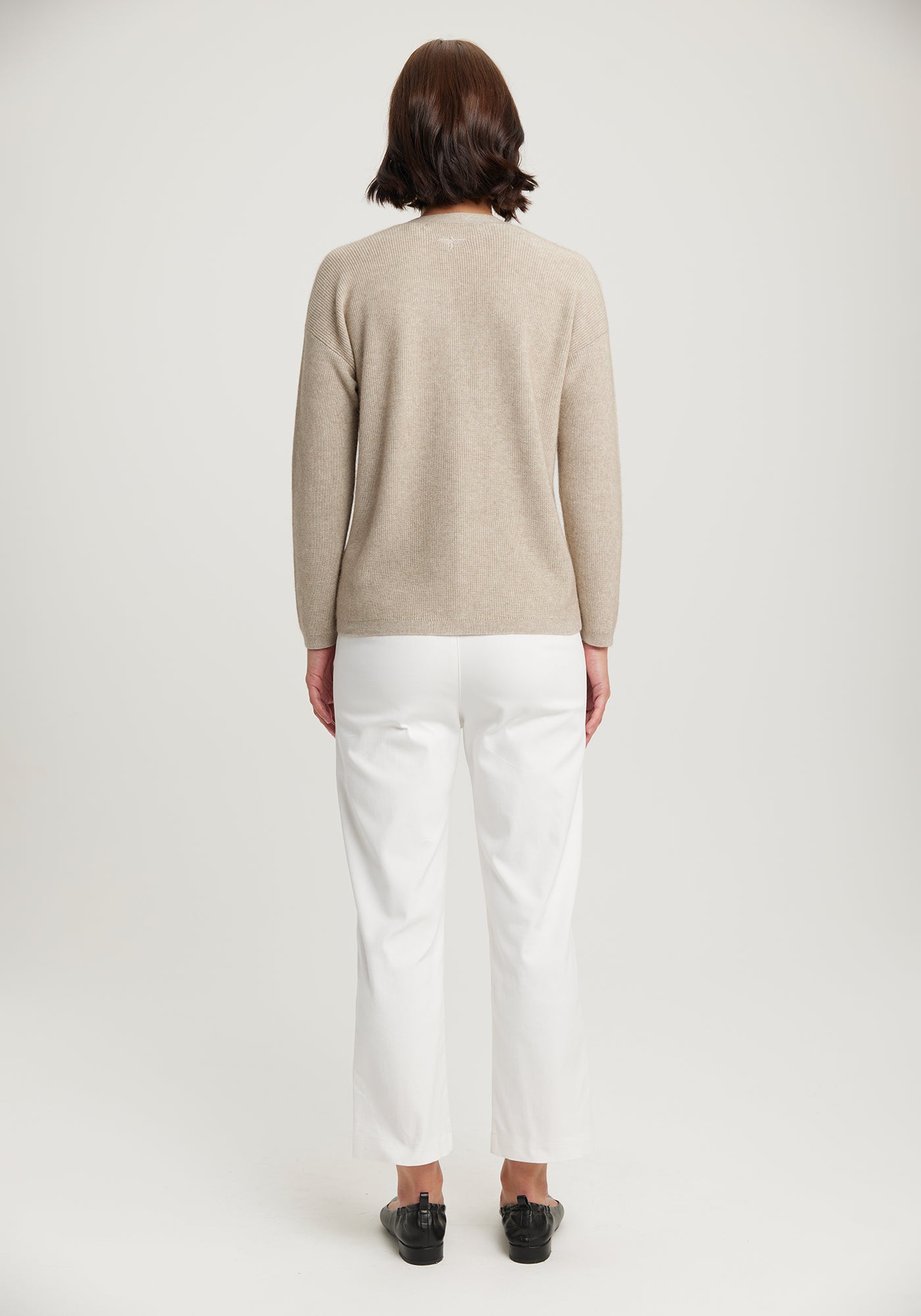 Iona Cardigan from THE ECOTREE COLLECTION available shopology Christchurch CBD. Wrap yourself up in the luxurious classic Iona Cardigan. It is lightweight, super soft V neckline in a delicate ribbed knit. It is made with lightweight ECOTREE yarn a combination of Tencel (sustainable Eucalyptus tree), Merino & ultra-fine Possum. Pair the Iona cardigan with any of the ECOTREE COLLECTION. (Especially the top & skirt) The three pieces together is an excellent ensemble.