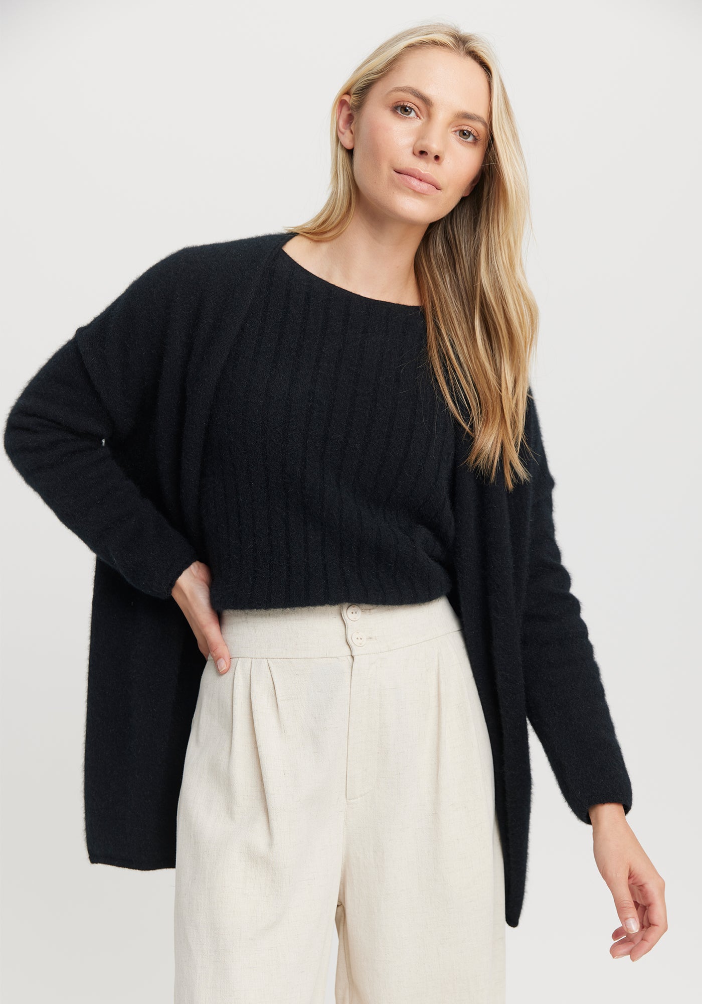 Cosy Cardi from Untouched World available shopology Christchurch CBD. This cosy cardi is effortless style and elegance all rolled into one silky soft cover up. Throw it on when you need a layer of warmth and instantly elevate your look. Made from UTW's exclusive Kapua blend of 40% Premium Possum Fibre, 40% Cashmere and 20% Mulberry Silk Pill resistant Regular fit