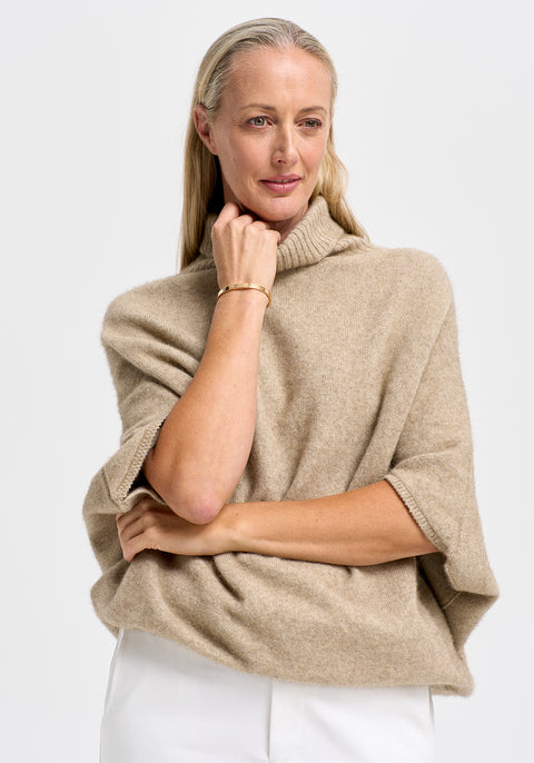Air Cape Sweater available shopology Christchurch, CBD.  Untouched World's popular Cape like sweater made out of their Ecopossum™ blend of merino, possum and silk.&nbsp; It’ll keep you warm while remaining breathable, whatever the weather. With a roll neck and knitted batwing sleeves, can be worn as a seasonal garment, with or without sleeves underneath. Looks equally great paired with denim, skirt or pants.