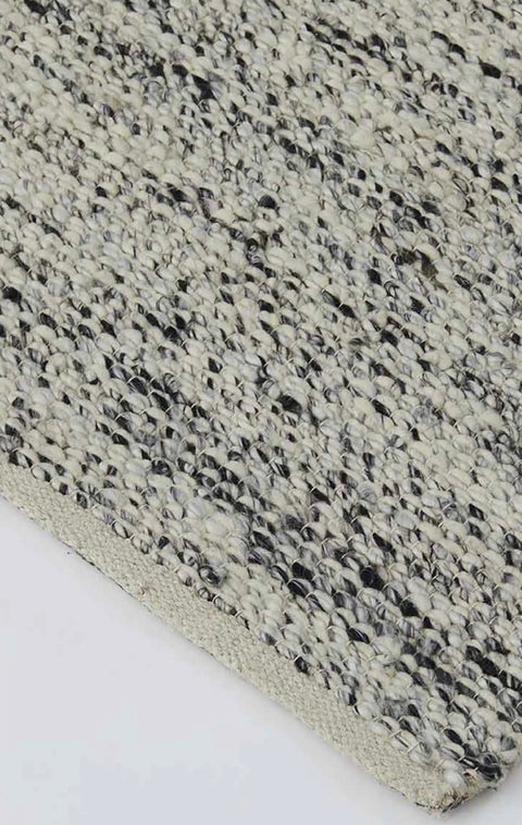 Available exclusive shopology, Christchurch CBD. Hand-woven with a bouclé-texture look 90% Wool and 10% Viscose Ethically hand-woven by artisans, the Dolomite rug is simply exquisite. This chameleon of a rug will blend effortlessly into any interior space, from classic to contemporary. Dolomite Pepper features a trending bouclé look, with salt and pepper tones speckled throughout.