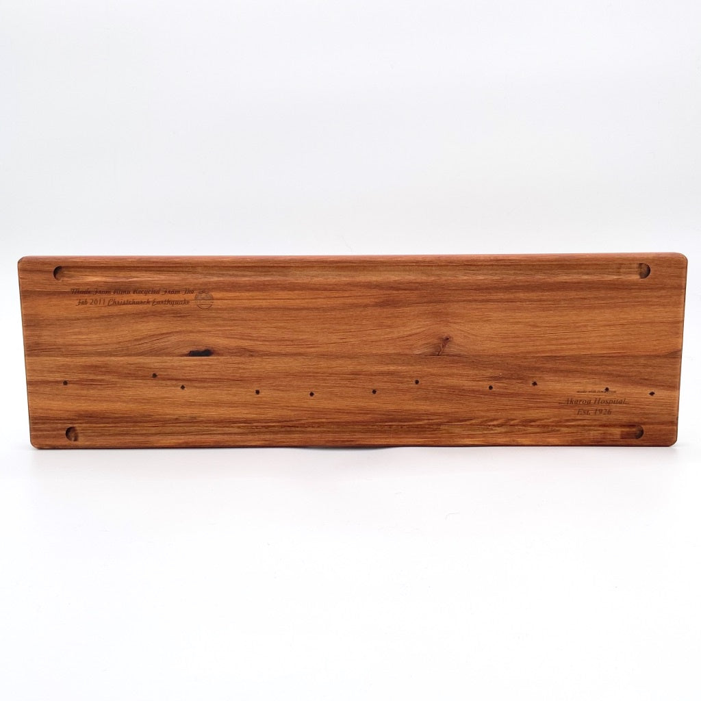 Rimu Serving board with groove handmade by local Artisan craftsman available shopology. Such a versatile Serving board, can be used for many uses. Made locally from native New Zealand Rimu wood, recycled from the Christchurch earthquake in 2011. All Serving boards are hand made, so know two boards will be the same. Will last for generations to come. An ideal gift. Two lengths / 50cm & 70cm, width 19.5cm, depth 1.5cm , made i New Zealand, local