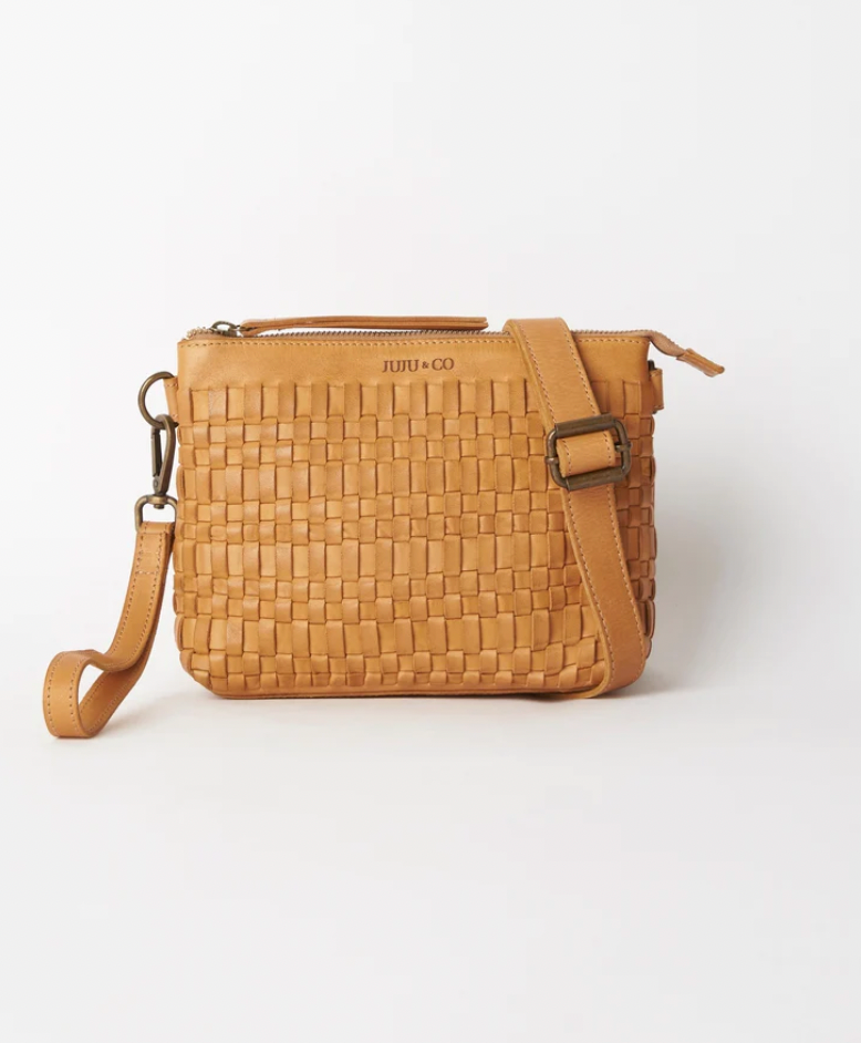 Woven leather pouch bag available shopology, Christchurch CBD. With it's thin leather weave, this bohemian design is the ideal summer accessory. Wear as a shoulder bag or crossbody by adjusting the strap, or use the wrist strap for use as a clutch or purse. 25CM x 18CM x 8CM Multi-textured (woven leather front and flat leather back) Zipper closure One internal zip pocket