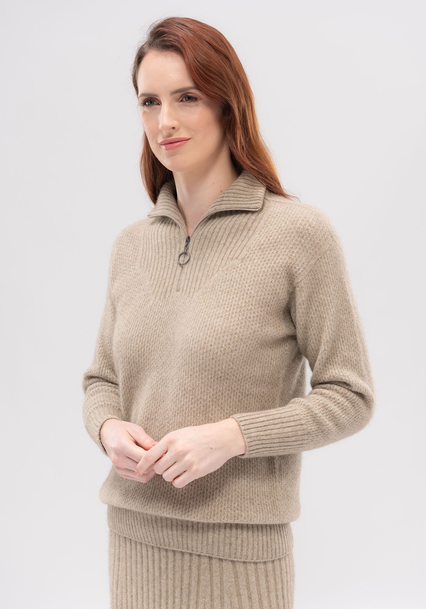Seraphina-zip Sweater Merinomink available shopology CBD, Zip neck with a ribbed stand collar. Textured body & sleeves. Rib neckline, collar, cuffs & waistband. Made locally in New Zealand from 50% Merino, 40% Possum & 10% Mulberry Silk. Looks so beautiful with the Emilia knit Skirt. Local, Canterbury, Sizes : Small, Medium , Large