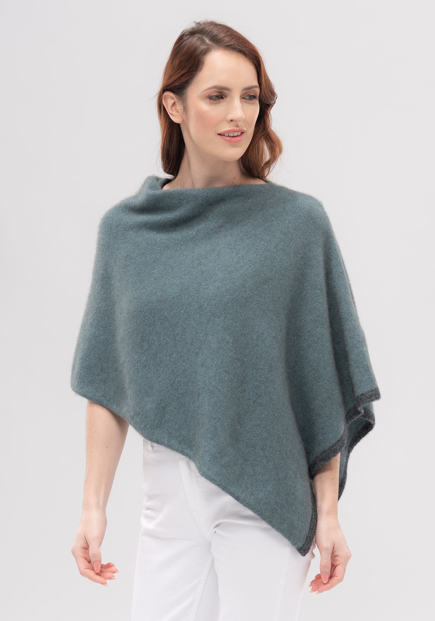 Two-tone Poncho Merino Mink available shopology, CBD, One colour is never enough in this amazing one-size-fits-Poncho. This easy throw-on piece can be worn various ways to create a different look. A touch of contrast tipping at the hem adds a little designer detail. 50% merino, 40% possum, 10% mulberry silk Multi-way Contrast colour tipping Cropped length, made in New Zealand, local, Canterbury