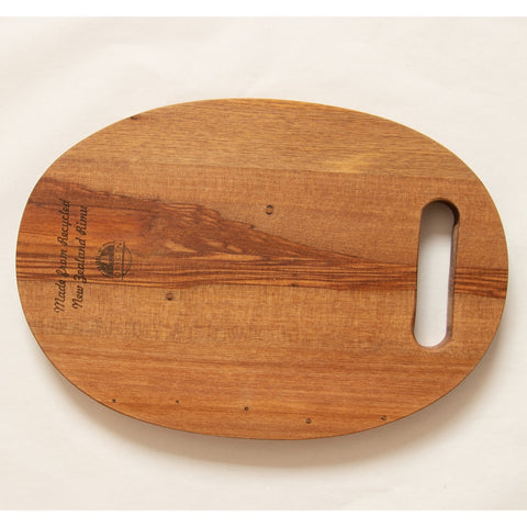 Rimu oval cheese board with cut out handle, Canterbury made, made in New Zealand, shopology, local, recycled from the Christchurch earthquake in 2011. Beautiful boards with a story that you can use everyday, native New Zealand rimu, Cheeseboard measures:  255mmx175mmx16mm.