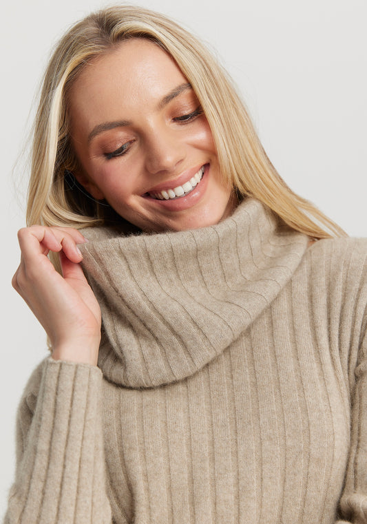 The Kapua Rib Snood from Untouched World available shopology Chrstchurch, CBD.  This classic rib snood is a perfect accompaniment to anyone of your favourite kapua sweaters. Designed to wear with UTW's Kapua Rib Crew, it instantly transforms a crew neckline into a rollneck. Just what you need on icy winter days when you want to keep the cold at bay.  Made from our exclusive Kapua blend of 40% Premium Possum Fibre, 40% Cashmere and 20% Mulberry Silk