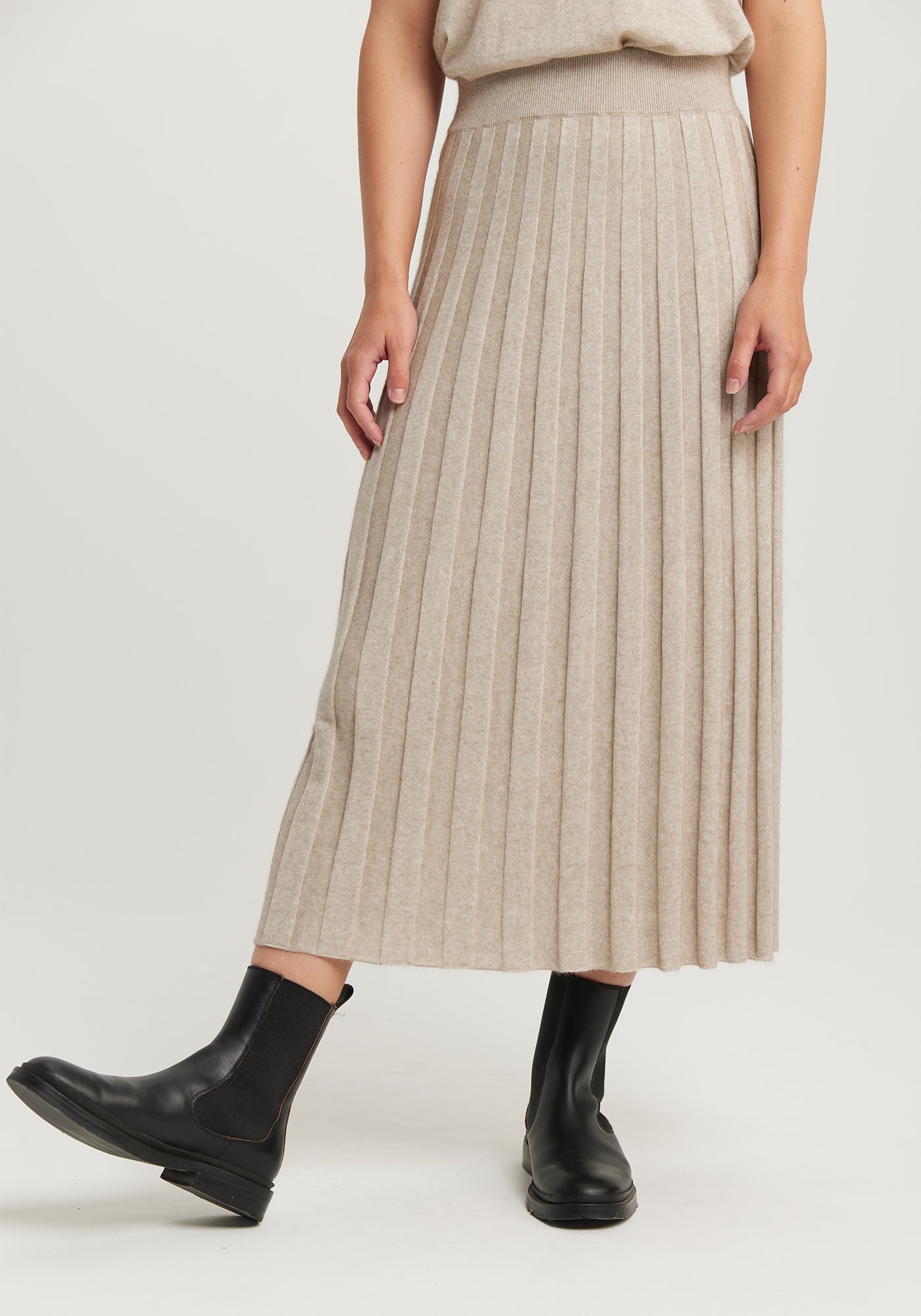 The Ella Skirt available shopology Christchurch, CBD.  Introducing the Ella Knit Skirt, made to pair with your EcoTree™ knits. Crafted from breathable TENCEL™, merino, and ultra-fine possum, it will keep you cosily cocooned in luxury. Featuring a wide waistband, it's all about style and luxury. It's the most comfortable skirt to wear, glides&nbsp; so nicely over your hips. Looks amazing with any of the EcoTree Knits.