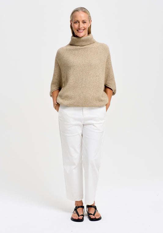 Air Cape Sweater available shopology Christchurch, CBD.  Untouched World's popular Cape like sweater made out of their Ecopossum™ blend of merino, possum and silk.&nbsp; It’ll keep you warm while remaining breathable, whatever the weather. With a roll neck and knitted batwing sleeves, can be worn as a seasonal garment, with or without sleeves underneath. Looks equally great paired with denim, skirt or pants.