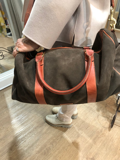 Baxter Travel bag available shopology Christchurch CBD.  Baxter travel bag in Chocolate suede wth tan leather trimming, double zip closure, with two open pockets and a zip pocket inner, two outside side pockets.&nbsp; Bag can be hand held or held over the shoulder with shoulder strap. Perfect size for a weekend away.  length 50cm, width 23cm, height 25cm.
