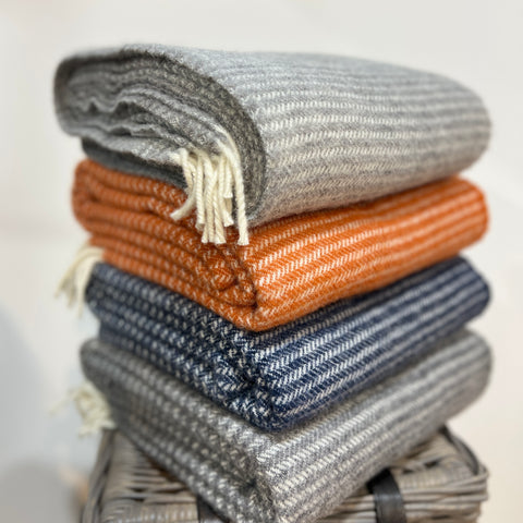 These beautiful and luxurious woven wool throws or blankets are made with New Zealand lambswool which can be traced back to the individual farm. The Ralph blanket features a subtle woven pattern with contrasting cream fringing. Soft and cosy lambswool has been sourced from sheep farmers in New Zealand using high, eco-friendly standards. They keep you warm on cold winter days or nights and become a nice and timeless detail on your sofa or bed. Available at www.shopology.co.nz