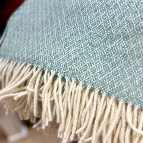 Buy this beautiful Sage green blanket, made from 100% soft pure lambs wool, grown, spun and woven entirely in New Zealand.  Perfect as a comforter for a double or queen bed, a throw on the sofa or to keep warm in the car as a travel rug.  100% natural lambs wool, quality, sustainable, ethical and traceable to the NZ farm. Available at www.shopology.co.nz