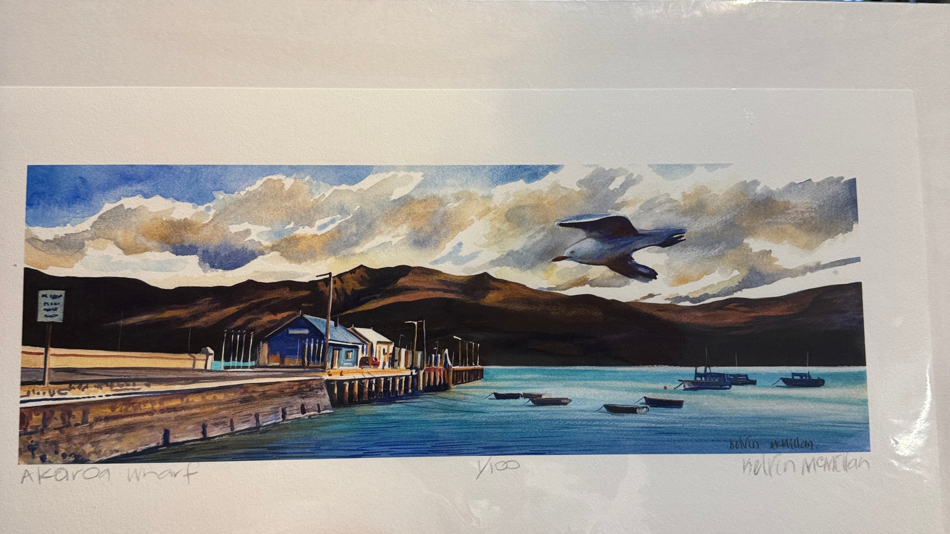 Unframed limited edition print of Akaroa Wharf featuring a seagull and small boats.