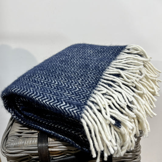 These beautiful and luxurious woven wool throws or blankets are made with New Zealand lambswool which can be traced back to the individual farm. The Chevron blanket features a subtle woven 'chevron' pattern with contrasting cream fringing. Soft and cosy lambswool has been sourced from sheep farmers in New Zealand using high, eco-friendly standards. They keep you warm on cold winter days or nights and become a nice and timeless detail on your sofa or bed. Available at www.shopology.co.nz