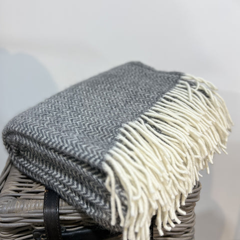 These beautiful and luxurious woven wool Blankets or throws are made with New Zealand lambswool which can be traced back to the individual farm. The Chevron blanket features a subtle woven 'chevron' pattern with contrasting cream fringing. Soft and cosy lambswool has been sourced from sheep farmers in New Zealand using high, eco-friendly standards. They keep you warm on cold winter days or nights and become a nice and timeless detail on your sofa or bed. Available at www.shopology.co.nz