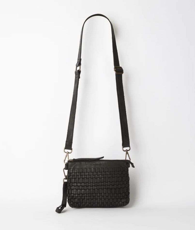 Woven leather pouch bag available shopology, Christchurch CBD.  With it's thin leather weave, this bohemian design is the ideal summer accessory. Wear as a shoulder bag or crossbody by adjusting the strap, or use the wrist strap for use as a clutch or purse.  25CM x 18CM x 8CM Multi-textured (woven leather front and flat leather back) Zipper closure One internal zip pocket 