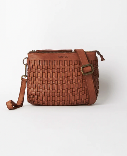 Woven leather pouch bag available shopology, Christchurch CBD.  With it's thin leather weave, this bohemian design is the ideal summer accessory. Wear as a shoulder bag or crossbody by adjusting the strap, or use the wrist strap for use as a clutch or purse.  25CM x 18CM x 8CM Multi-textured (woven leather front and flat leather back) Zipper closure One internal zip pocket 