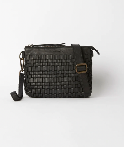 Woven leather pouch bag available shopology, Christchurch CBD.  With it's thin leather weave, this bohemian design is the ideal summer accessory. Wear as a shoulder bag or crossbody by adjusting the strap, or use the wrist strap for use as a clutch or purse.  25CM x 18CM x 8CM Multi-textured (woven leather front and flat leather back) Zipper closure One internal zip pocket 