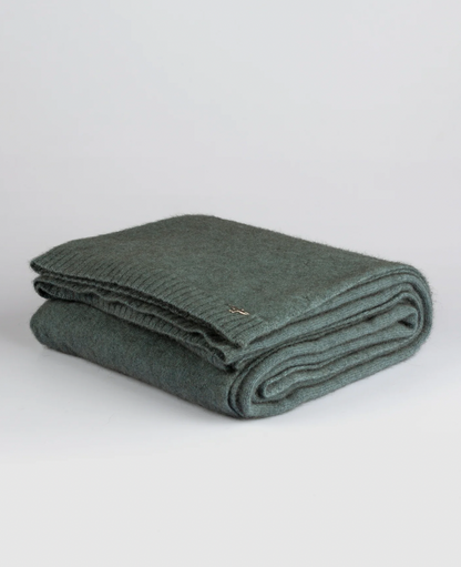 Luxurious Throw exclusive Ecopossum blend, Untouched World, 50% merino, 40% possum & 10% mulberry silk blend, made in New Zealand, premium blend of fine ZQ certified merino, brush tail possum, featherweight softness with warmth & durability, pill resistant, eco & sustainable, gift, New Zealand wool product, knitwear, wool, washable, Shopology, tourist, sustainable, stylish, natural, merino yarn, lightweight, itch-free, fashion, easy-care, local, exclusive CBD, made in Canterbury.  www.shopology.co.nz