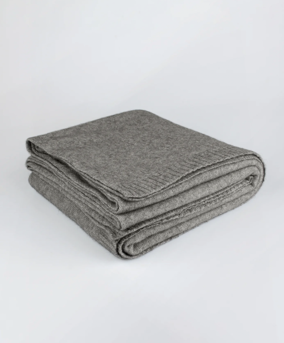 Luxurious Throw exclusive Ecopossum blend, Untouched World, 50% merino, 40% possum & 10% mulberry silk blend, made in New Zealand, premium blend of fine ZQ certified merino, brush tail possum, featherweight softness with warmth & durability, pill resistant, eco & sustainable, gift, New Zealand wool product, knitwear, wool, washable, Shopology, tourist, sustainable, stylish, natural, merino yarn, lightweight, itch-free, fashion, easy-care, local, exclusive CBD, made in Canterbury.  www.shopology.co.nz