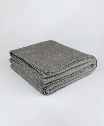 Luxurious Throw exclusive Ecopossum blend, Untouched World, 50% merino, 40% possum & 10% mulberry silk blend, made in New Zealand, premium blend of fine ZQ certified merino, brush tail possum, featherweight softness with warmth & durability, pill resistant, eco & sustainable, gift, New Zealand wool product, knitwear, wool, washable, Shopology, tourist, sustainable, stylish, natural, merino yarn, lightweight, itch-free, fashion, easy-care, local, exclusive CBD, made in Canterbury.  www.shopology.co.nz