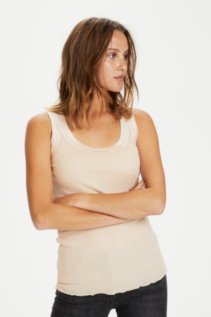 Maya Tank Top by Saint Tropez available shopology, Christchurch CBD.  Maya tank top is more like a singlet top. Looks great bunched up or worn long. Neckline &amp; armhole finished with double layer Satin binding. Designed to sit perfectly under your arm. Scooped front neckline &amp; a straight back neckline.  Looks fabulous worn on it's own or under a Jacket or Cardigan.  70% Cotton, 30% Silk.